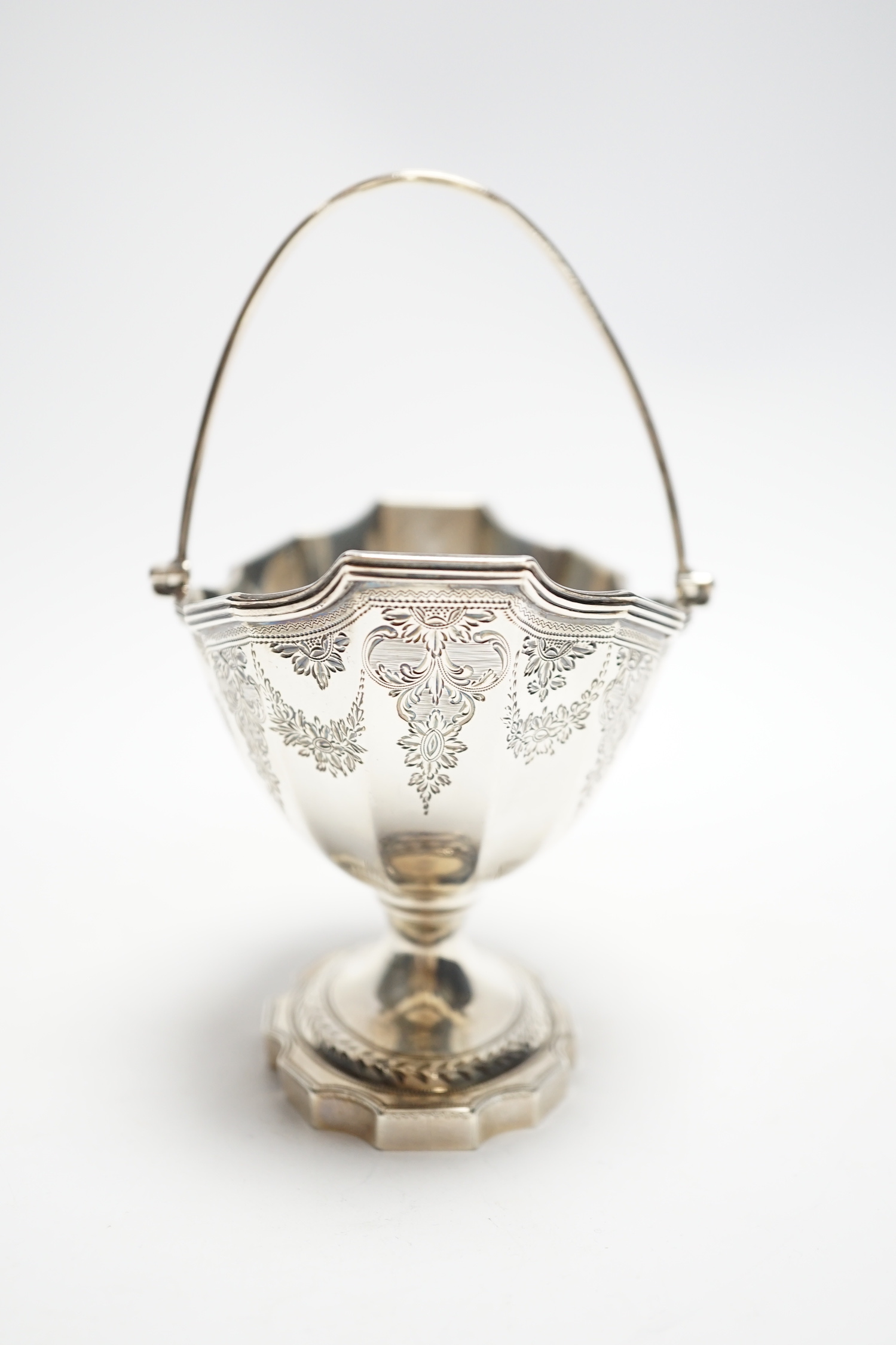 A George III silver boat shaped pedestal sugar basket, John Hutson, London, 1788, length 13.2cm, 5.6oz.